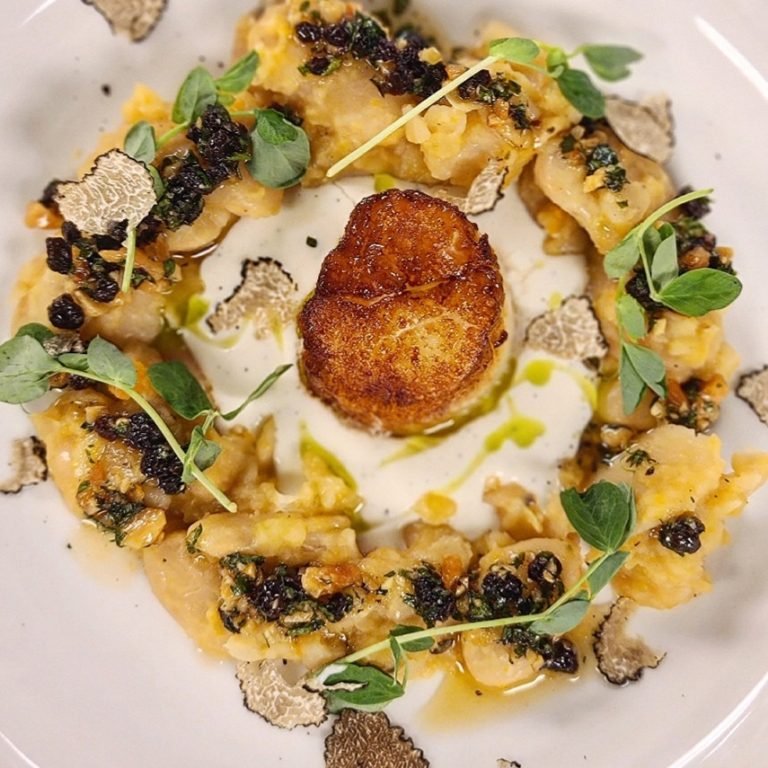 Pan seared sea scallop and Bulgarian Osetra caviar, puree of cauliflower, gigante bean ragu, almond and currrant gremolata, black burgundy truffle