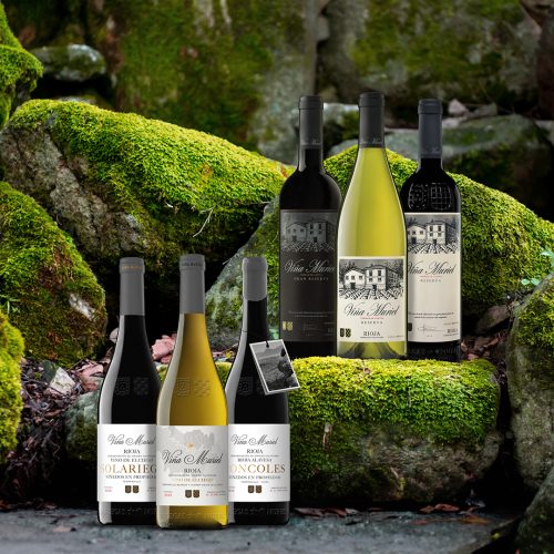 6 bottles of Villa Muriel wine in various varietals set outdoors