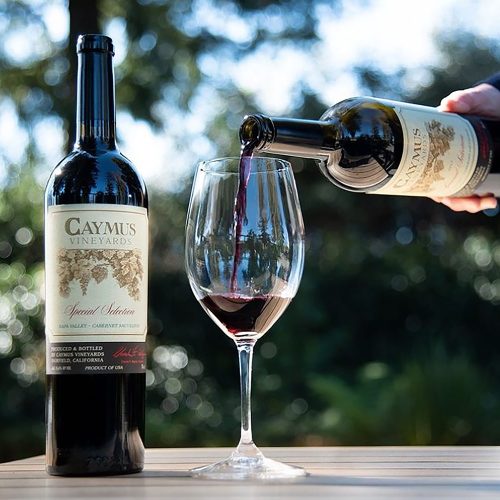 Caymus being poured into glass outside